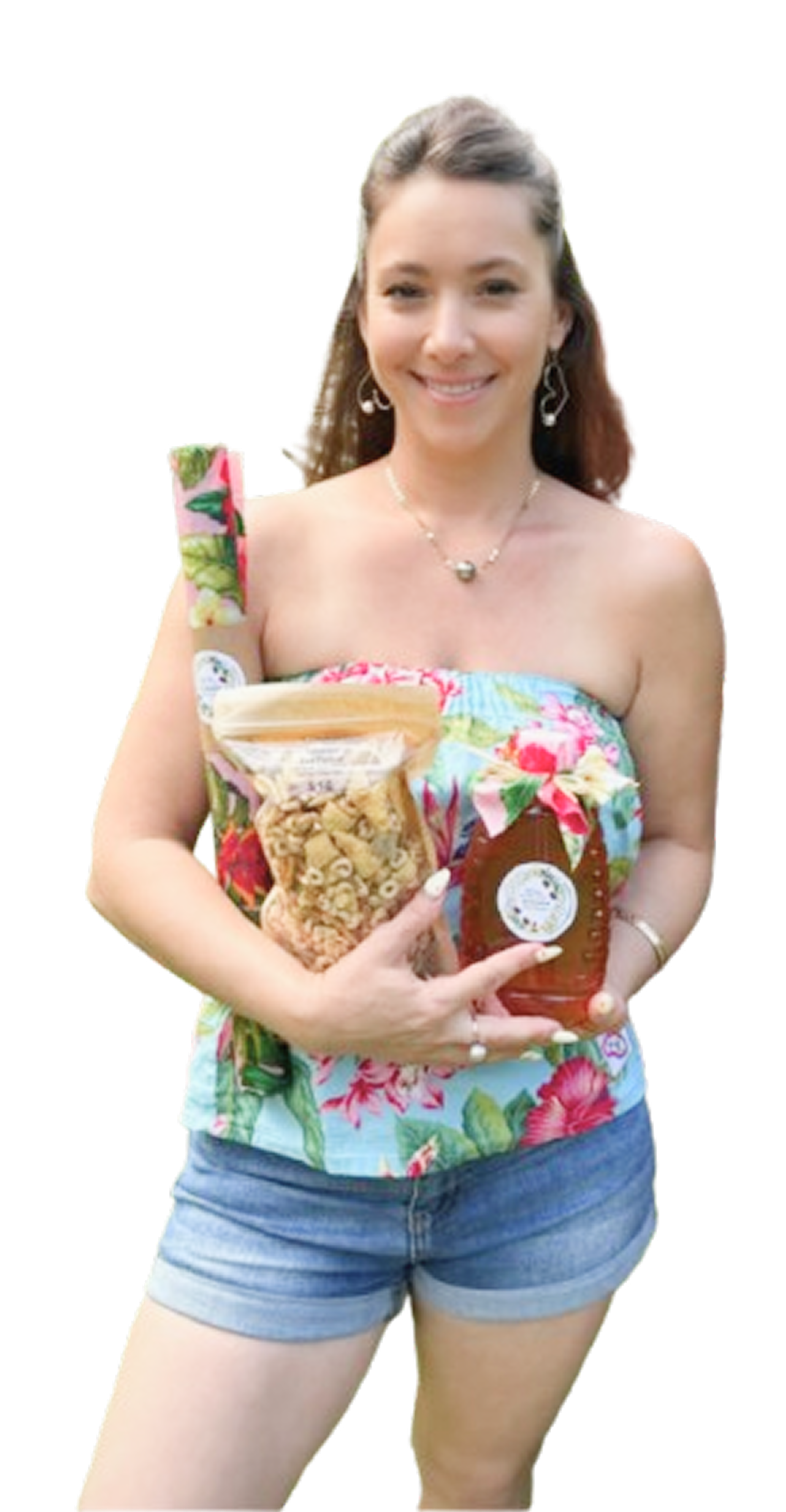 Kristal from Tynanes Bee Farms holding a bag of honey snack mix and a bottle of honey